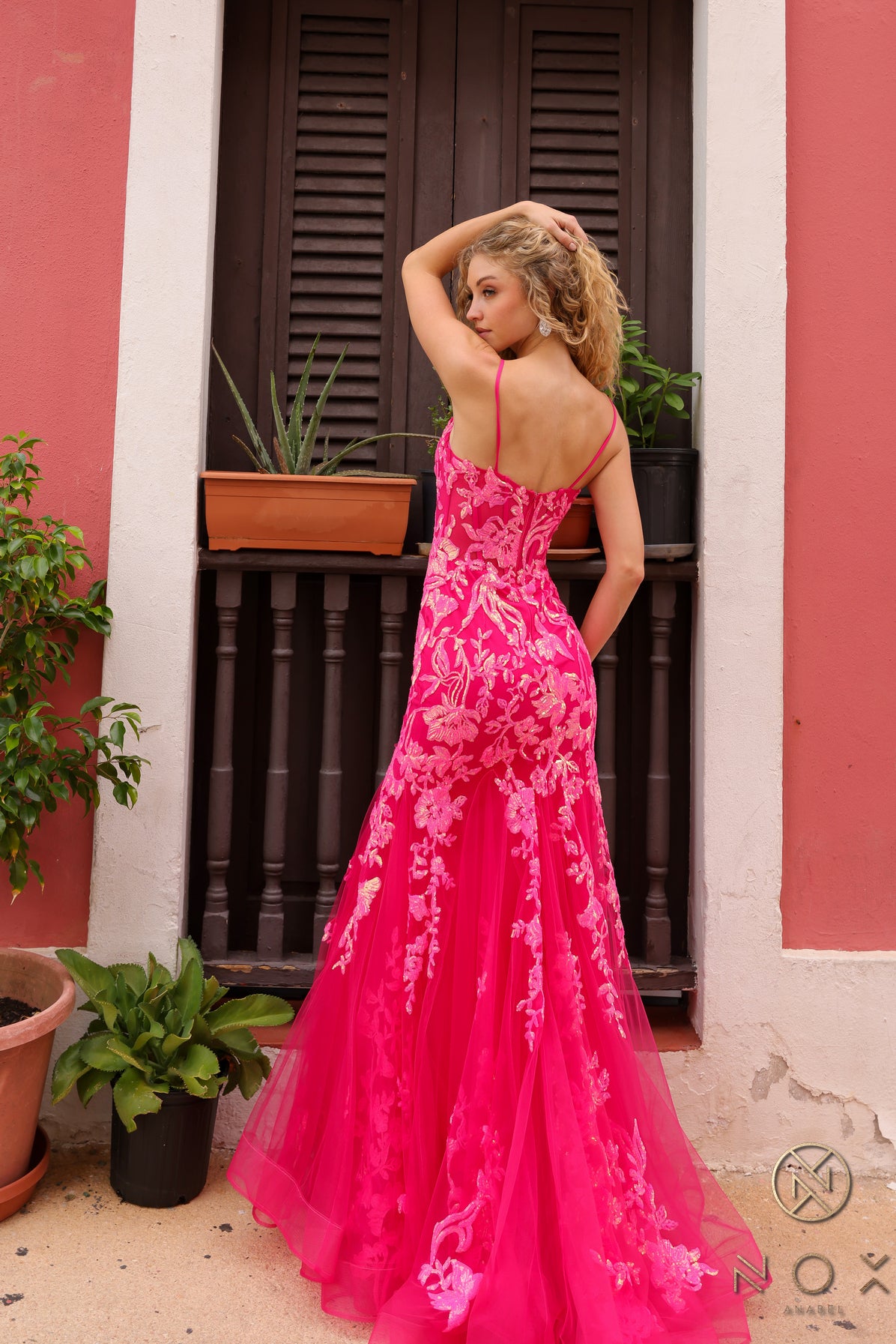 Elevate your prom or pageant look with the Nox Anabel Q1390 Prom Dress. Featuring a long sequin body with a sheer corset and mermaid silhouette, this dress will have you shining all night. Stand out in vibrant neon while feeling confident and elegant.  Sizes: 0-16  Colors: Neon Green, Neon Orange, Coral Fuchsia, Ocean Blue