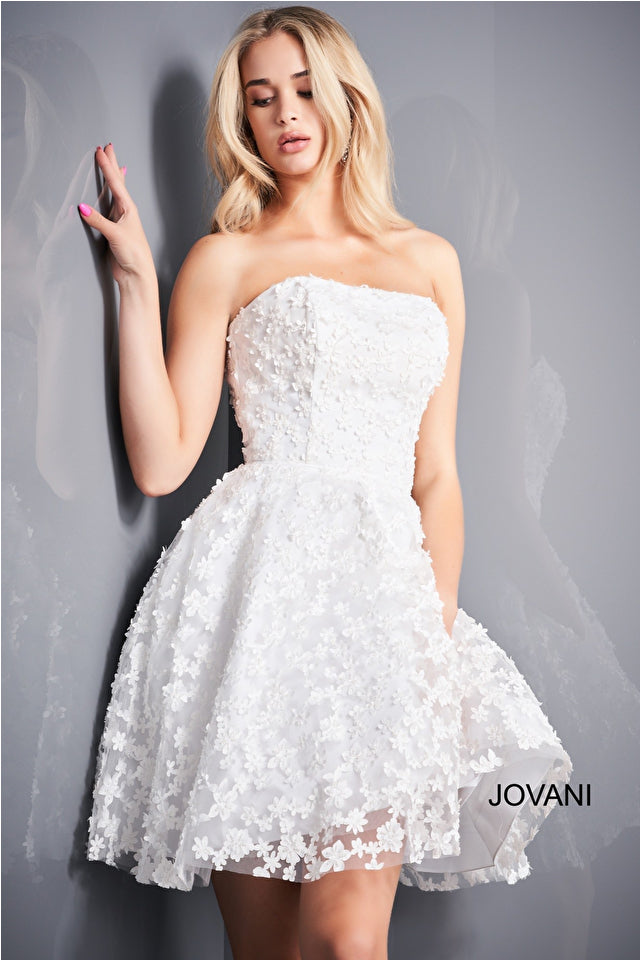 Jovani K02564 Fit and Flare Strapless Floral Girls Short Dress. Add some garden-inspired glamour to any occasion with this Jovani K02564 dress! Crafted from a luxe floral fabric, this fit and flare strapless dress will make your little girl look like she just stepped out of the fairytale. Flounce around in style!