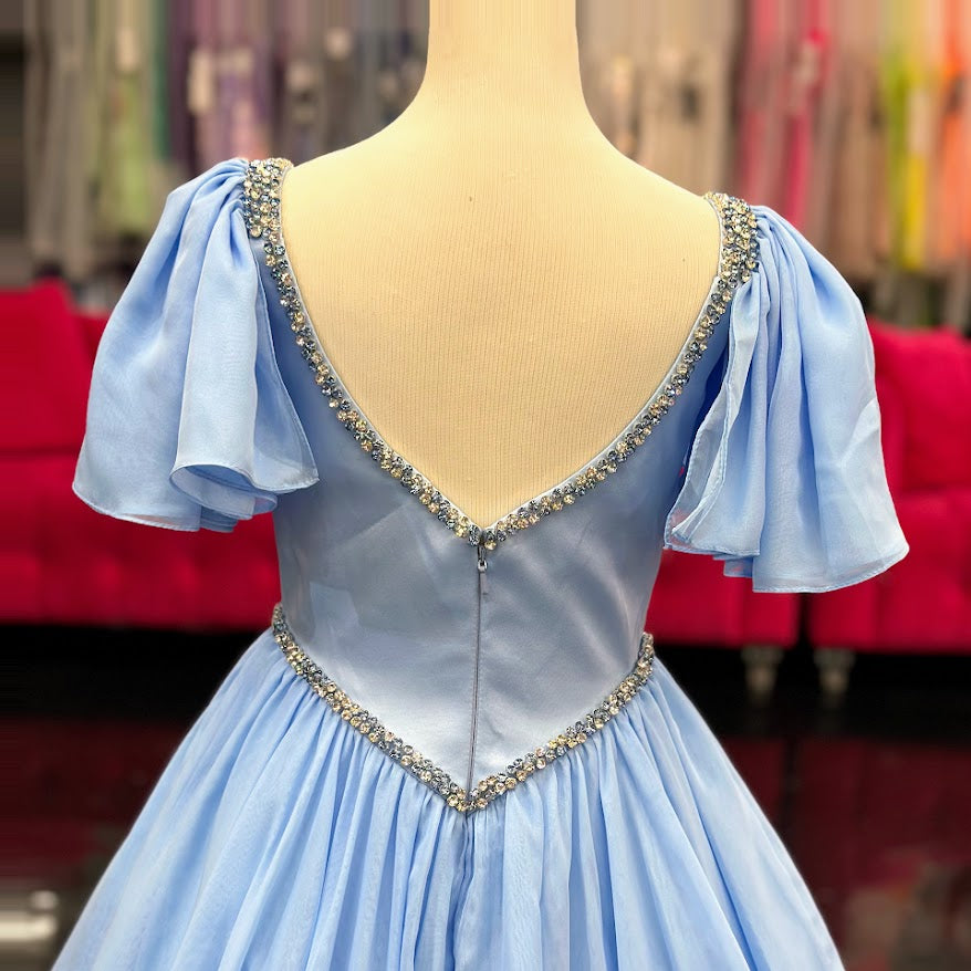 Make your little girl feel like a princess in the Samantha Blake 1126 Girls Pageant Dress. Featuring Chiffon ruffle cap sleeves and a satin bodice, this formal gown exudes elegance and charm. With an A-line silhouette, it flatters any figure and is perfect for pageants or special occasions.