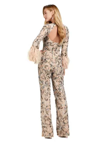 The Ashley Lauren 11394 Fully Beaded Jumpsuit with Feathers is a stunning choice for any formal event. This jumpsuit features intricate beading and elegant feather detailing, adding an extra touch of luxury. Designed by Ashley Lauren, a renowned expert in the fashion industry, this jumpsuit is sure to make a statement. Perfect for prom or any special occasion. Make a statement in this extravagant jumpsuit! Fully beaded with an open back and feathered cuffs, the details in this jumpsuit is sure to WOW!