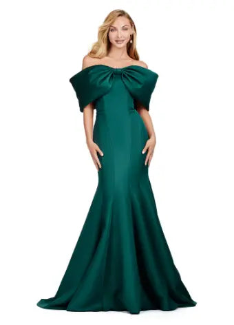 Experience elegance with the Ashley Lauren 11413 Long Prom Dress. Designed with an off-shoulder neckline, this dress is crafted from luxurious double-faced satin and features an oversized bow for added drama. Perfect for formal events and pageants, this dress will make you stand out with its sophisticated and flattering silhouette. Talk about elegant. This off shoulder gown is complete with an oversized bow along the neckline. This double faceted satin gown has a mermaid silhouette.