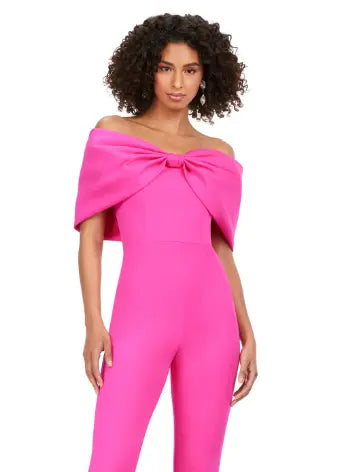 Make a statement at your next formal event with the Ashley Lauren 11414 Off Shoulder Scuba Jumpsuit. Its stylish off-shoulder design and oversized bow add a touch of elegance, while the scuba material provides a comfortable and flattering fit. Perfect for prom or any special occasion. Turn heads in this jumpsuit! This look is complete with an oversized bow off shoulder neckline.