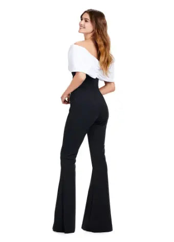 Make a statement at your next formal event with the Ashley Lauren 11414 Off Shoulder Scuba Jumpsuit. Its stylish off-shoulder design and oversized bow add a touch of elegance, while the scuba material provides a comfortable and flattering fit. Perfect for prom or any special occasion. Turn heads in this jumpsuit! This look is complete with an oversized bow off shoulder neckline.