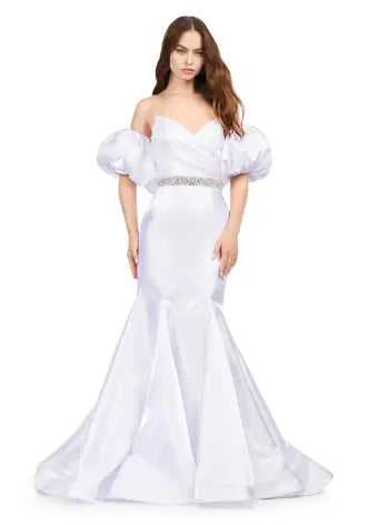 Expertly crafted by Ashley Lauren, this 11419 Long Prom Dress boasts a stunning mermaid silhouette with a strapless design and luxurious satin fabric. The oversized puff sleeves add a bold and elegant touch, making you stand out at any formal event or pageant. Elevate your look with this timeless and sophisticated gown.  Voluminous puff sleeves and a classic sweetheart neckline frame this stunning gown. With its mermaid fit and jeweled belt, this gown is a dream come true!