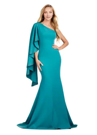 Elevate your formal ensemble with the Ashley Lauren 11421 Long Prom Dress. This fitted one shoulder gown features cascading ruffle sleeves, adding an elegant touch to your look. Perfect for pageants and prom, this dress is sure to make a statement. Expertly crafted for a flawless fit. This dress is all about classic elegance. The one shoulder design features a cascading ruffle sleeve with press on stone details.