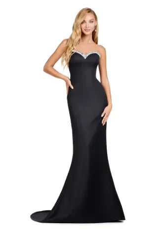 Combining elegance and modern style, the Ashley Lauren 11424 Long Prom Dress is perfect for any formal event. The fitted strapless design flatters your figure, while the oversized off-shoulder bow adds a touch of sophistication. With its stunning overlay and sleek silhouette, this dress will make you stand out in any pageant or evening occasion. Dazzle the crowd with this stunning strapless evening gown. The look is complete with a separate halter style overlay adding elegance to the look.