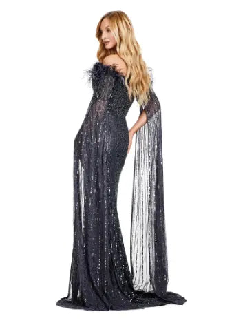 Expertly crafted by Ashley Lauren, the 11429 Long Prom Dress is a stunning piece that combines fully sequined fabric, delicate feathers, and elegant floor-length sleeves. Perfect for formal events and pageants, this gown is sure to make you stand out with its unique design and impeccable craftsmanship. Bring all the glamour in this fully beaded gown with floor length sleeves. The feather details take this look to the next level.