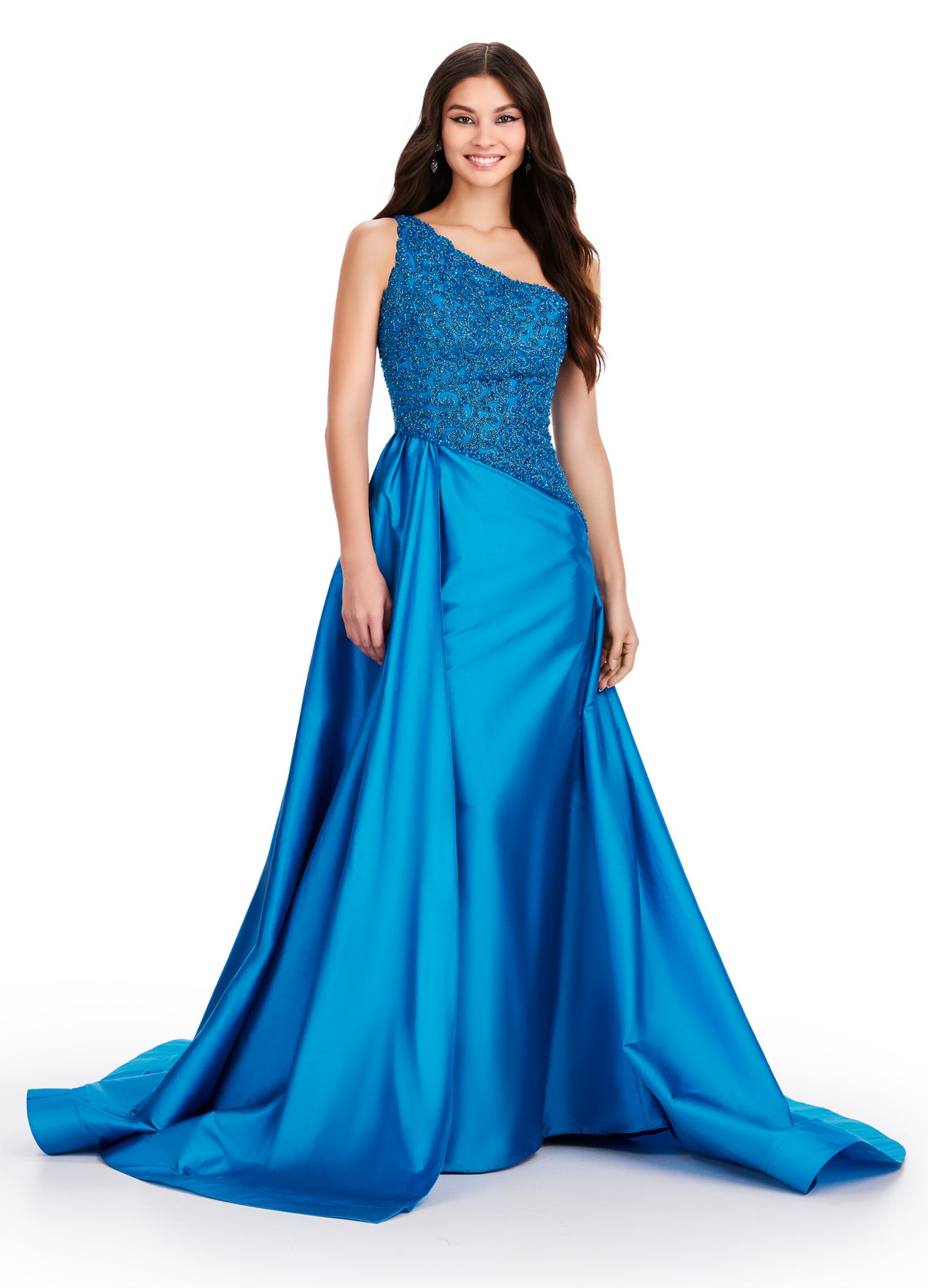 This Ashley Lauren 11456 Long Prom Dress features a one shoulder design with a beautiful taffeta fabric and a stunning beaded bodice. Elevate your formal look with this pageant-worthy gown. Expertly crafted with attention to detail, this dress is sure to make a statement. A dress sure to make you feel like royalty! This one shoulder gown features a fully beaded bodice and a dramatic taffeta overskirt.