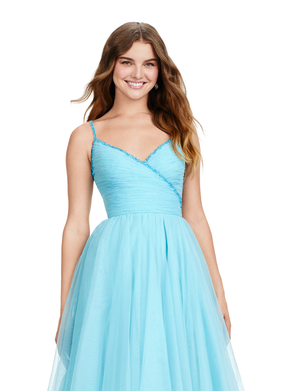 The Ashley Lauren 11461 Long Prom Dress is the perfect choice for your formal occasion. This elegant gown features delicate spaghetti straps and a tulle ball gown skirt for a timeless look. The intricate beaded detailing adds a touch of sparkle, making you stand out from the crowd. Experience the ultimate in luxury with this pageant-worthy dress. This simplistic ball gown features dainty beaded spaghetti straps with a ruched bodice.