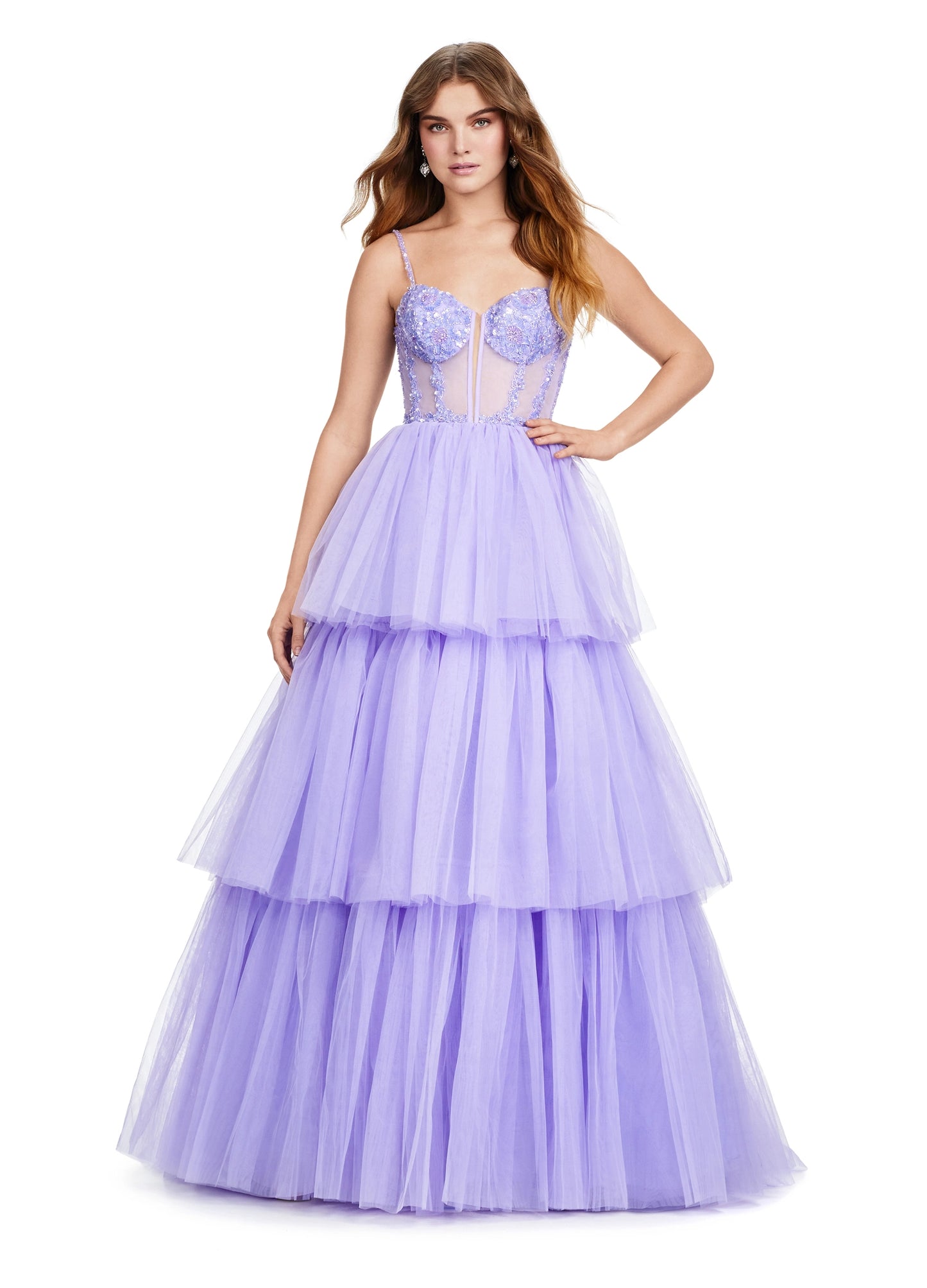 The Ashley Lauren 11462 Sheer Beaded Corset Layer Tulle Prom Dress Ballgown Pageant Tiered Gown is a statement-making piece. Crafted from sheer corset layers, delicate beadwork, and tiered tulle, it's perfect for any special occasion. Elegant and eye-catching, this dress features the perfect balance of comfort and sophistication.