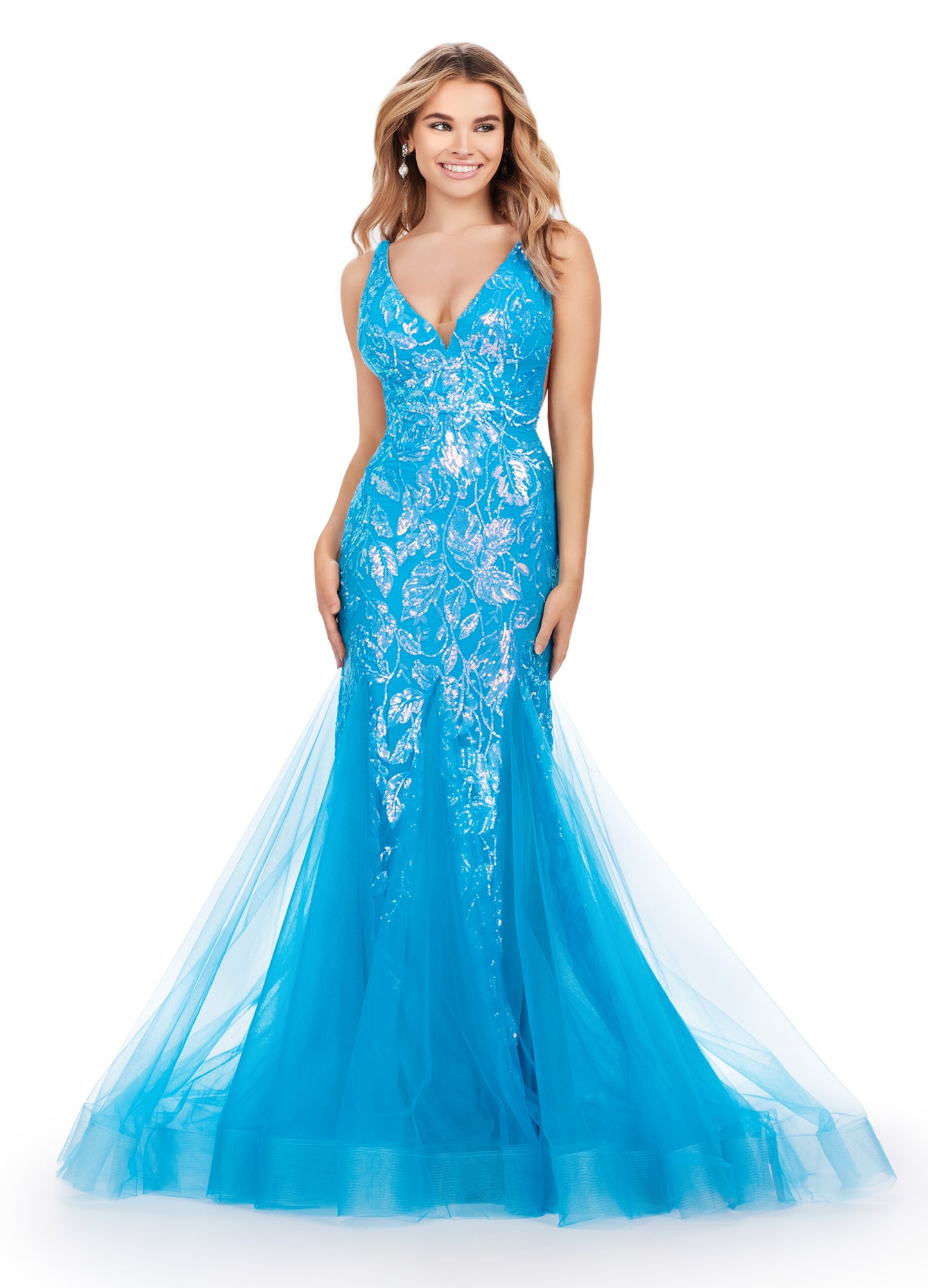 Get ready to command attention in the Ashley Lauren 11472 Long Prom Dress. With a stunning V-neck, sequin embellishments, and a mermaid skirt made with stretchy fabric, this gown is designed to enhance your figure and make you shine. Perfect for formal events, pageants, and more. Can you say iconic? This stretch sequin gown features a v-neckline and a pleated tulle skirt to help you slay your next event.