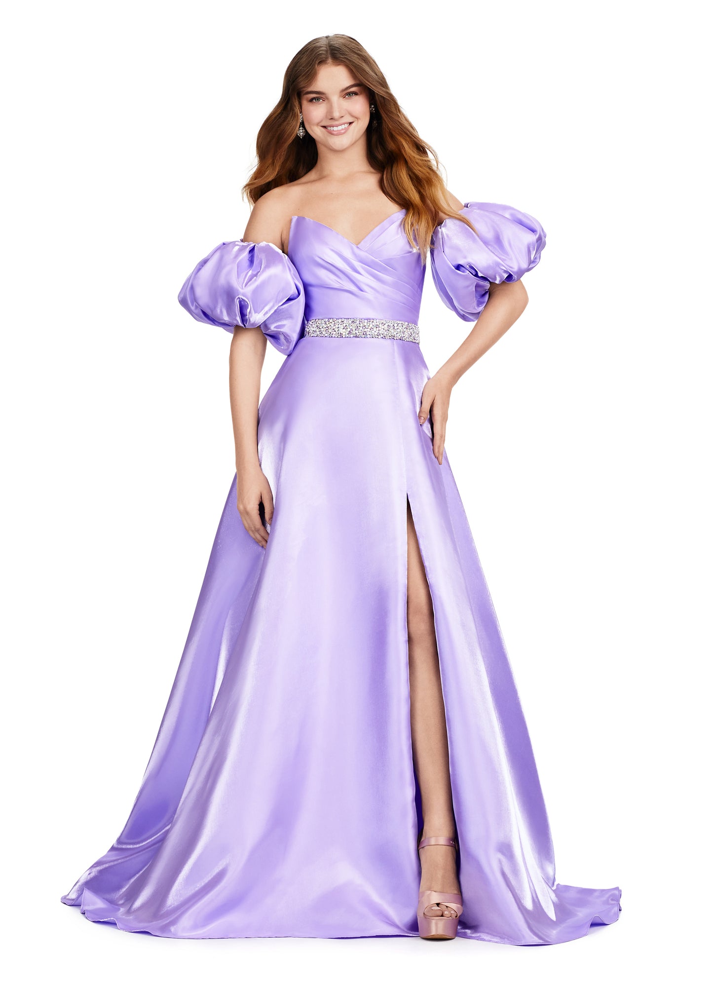 Elevate your formal look with the Ashley Lauren 11474 Long Prom Dress. This elegant strapless satin ball gown boasts a beaded belt, detachable puff sleeves, and a timeless pageant-style design. Perfect for making a statement at any event, this dress exudes sophistication and style. Be memorable in this strapless satin ball gown. This dress features a beaded belt detail, a left leg slit and detachable puff sleeves.