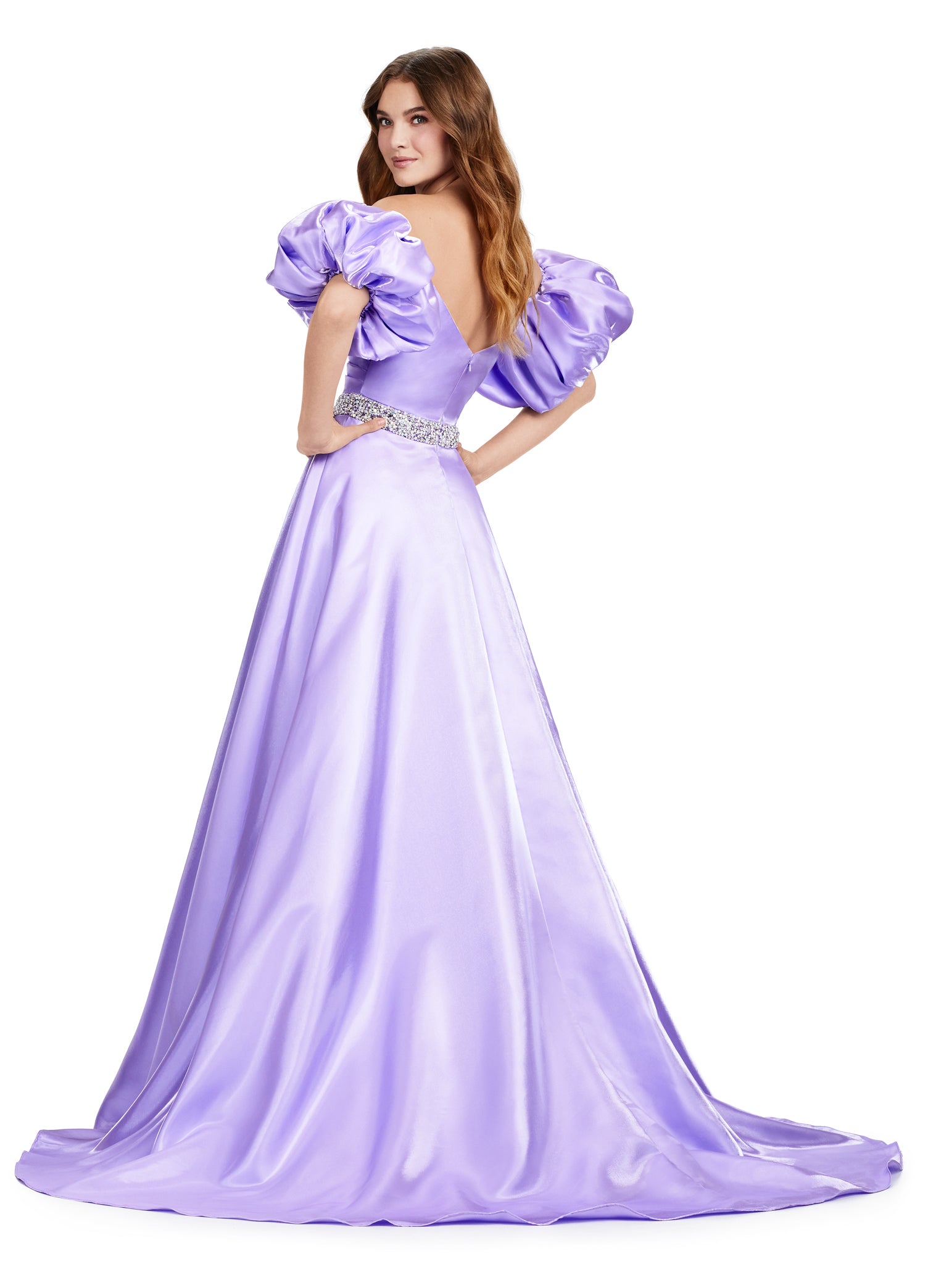 Elevate your formal look with the Ashley Lauren 11474 Long Prom Dress. This elegant strapless satin ball gown boasts a beaded belt, detachable puff sleeves, and a timeless pageant-style design. Perfect for making a statement at any event, this dress exudes sophistication and style. Be memorable in this strapless satin ball gown. This dress features a beaded belt detail, a left leg slit and detachable puff sleeves.