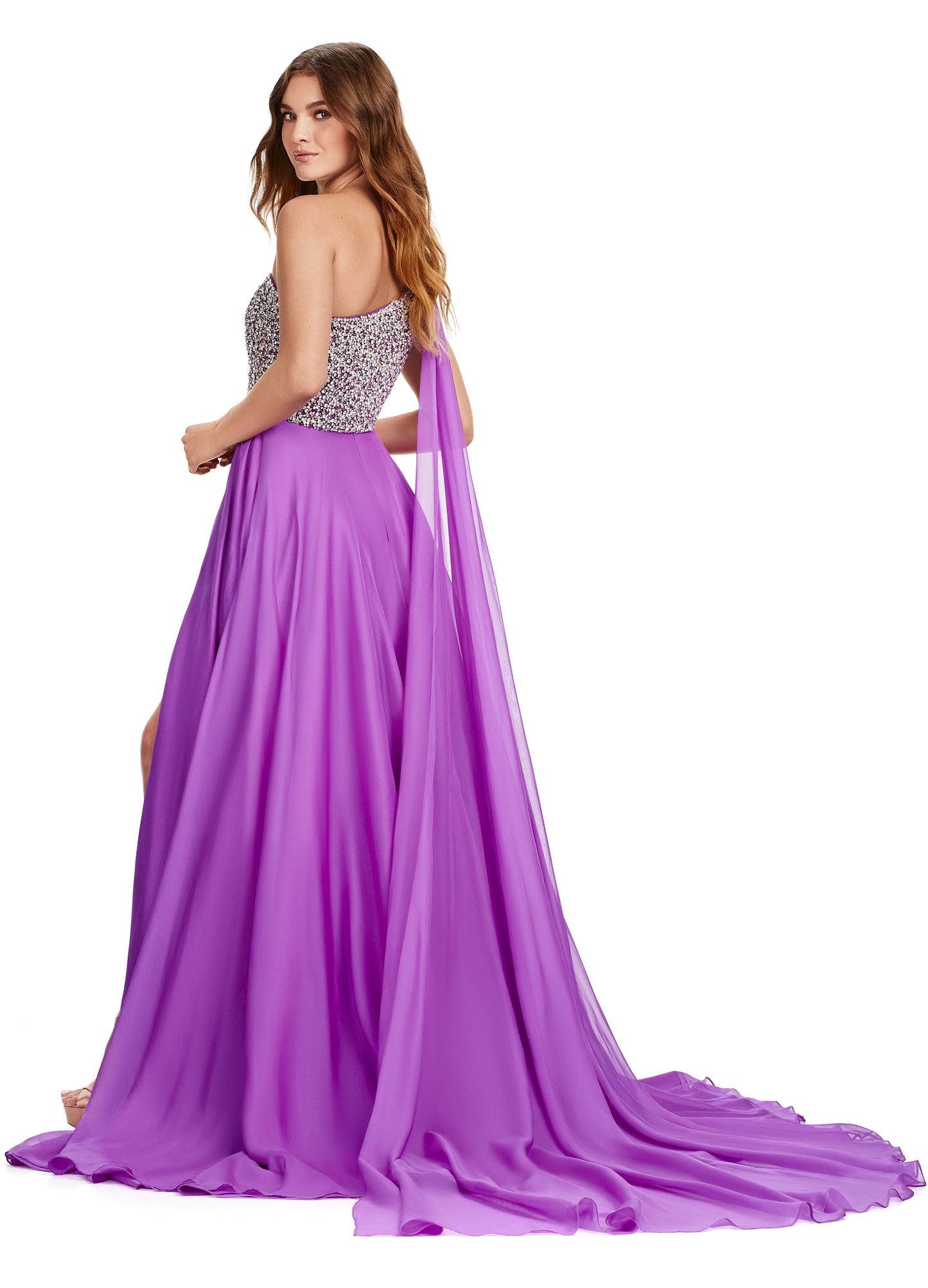 Introducing the show-stopping Ashley Lauren 11482 Long Prom Dress! This elegant gown features a one-shoulder design and flowing chiffon fabric, perfect for any formal occasion. The stunning beaded bustier adds a touch of sparkle and glamour, making you the center of attention. Elevate your style with this must-have pageant gown. A dress fit for a queen!