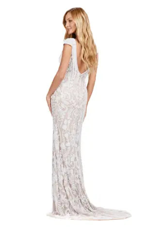 Elevate your formal style with the Ashley Lauren 11497 Fully Beaded V-Neck Evening Gown. The intricate beading, cap sleeves, and center slit create a stunning silhouette that will surely make a statement. Perfect for special occasions, this gown exudes elegance and sophistication. This fully beaded gown is perfect for your next event. This elegant dress features cap sleeves and a V-Neckline with a center slit to compliment the look.