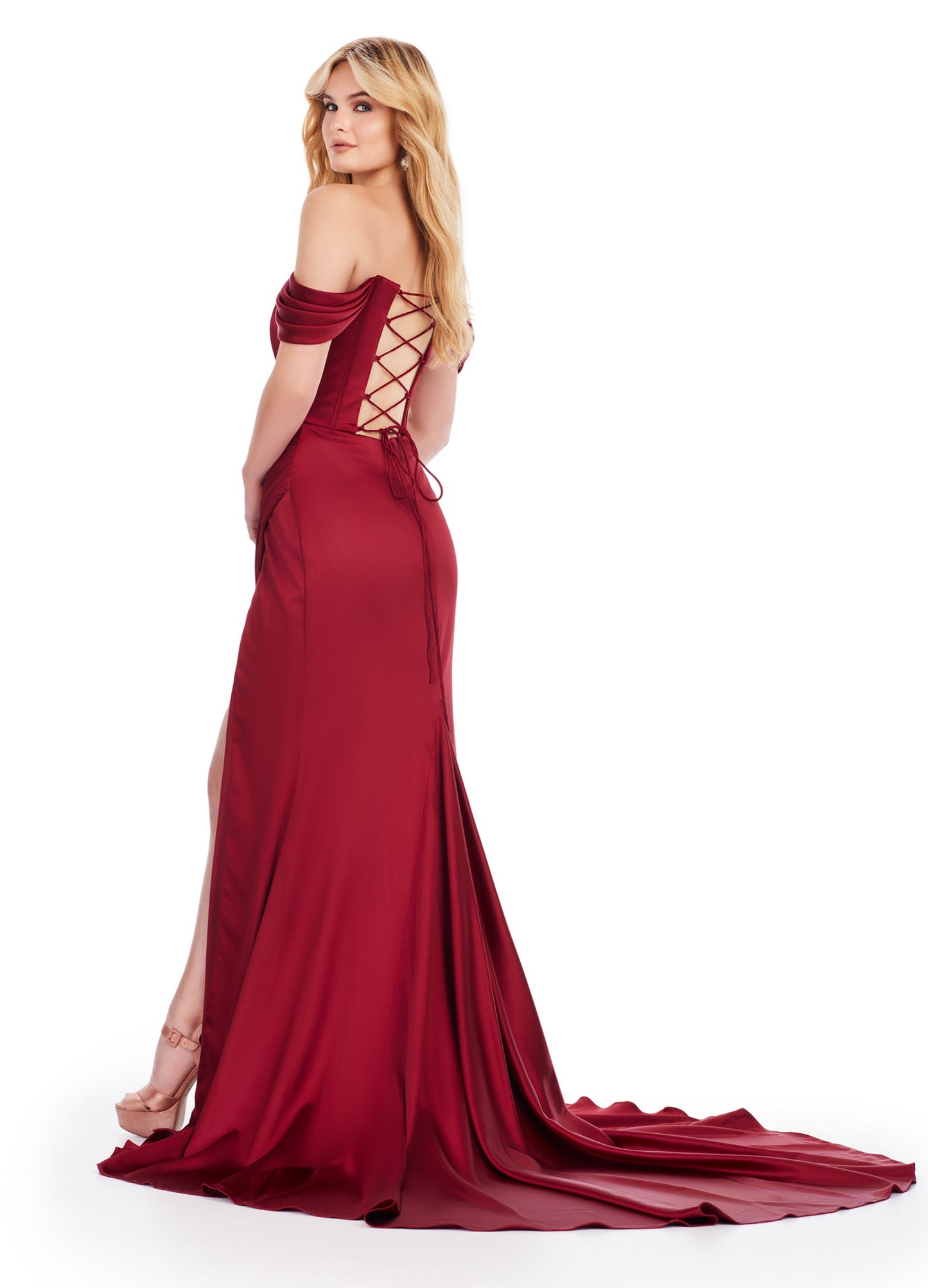 Expertly crafted by Ashley Lauren, this long prom dress features a stunning corset, elegant off shoulder design, and luxurious satin fabric. The daring high slit and flattering ruched hip accentuate your figure, making it perfect for formal events and pageants. Elevate your style with this exquisite gown. This strapless satin gown with corset bustier is accented by an elegantly draped skirt with slit. The look is complete with a sweep train and lace up back.