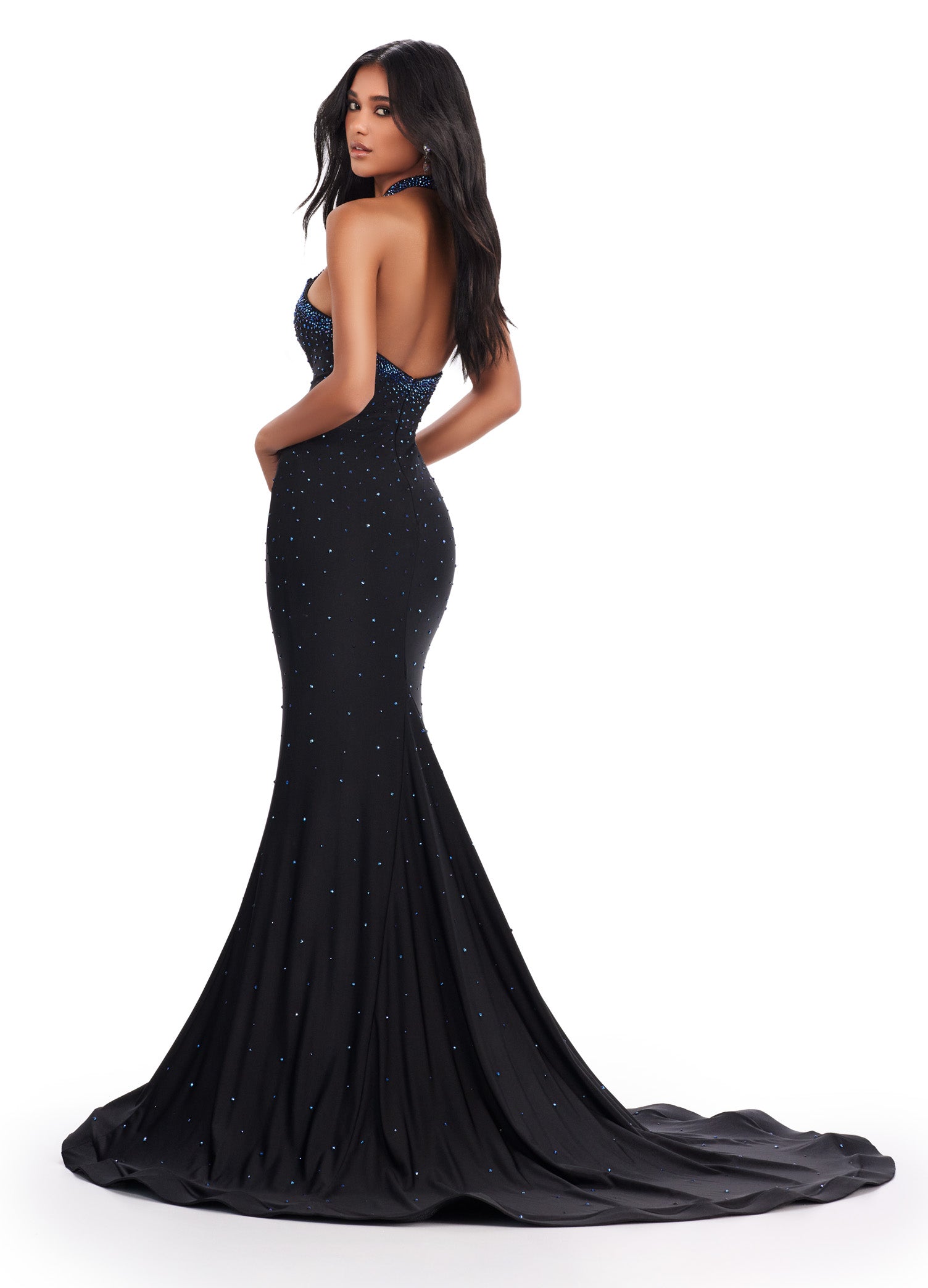 Be the star of the prom with the Ashley Lauren 11578 Long Prom Dress. Designed with a mermaid silhouette and cut-outs, this elegant gown is made of high-quality jersey fabric. The dress also features press on stones, adding a touch of glamour. Perfect for formal events and pageants. Dance the night away in this edgy and fabulous jersey gown. This dress features a halter design with cut outs and press on stones make this dress stand out.