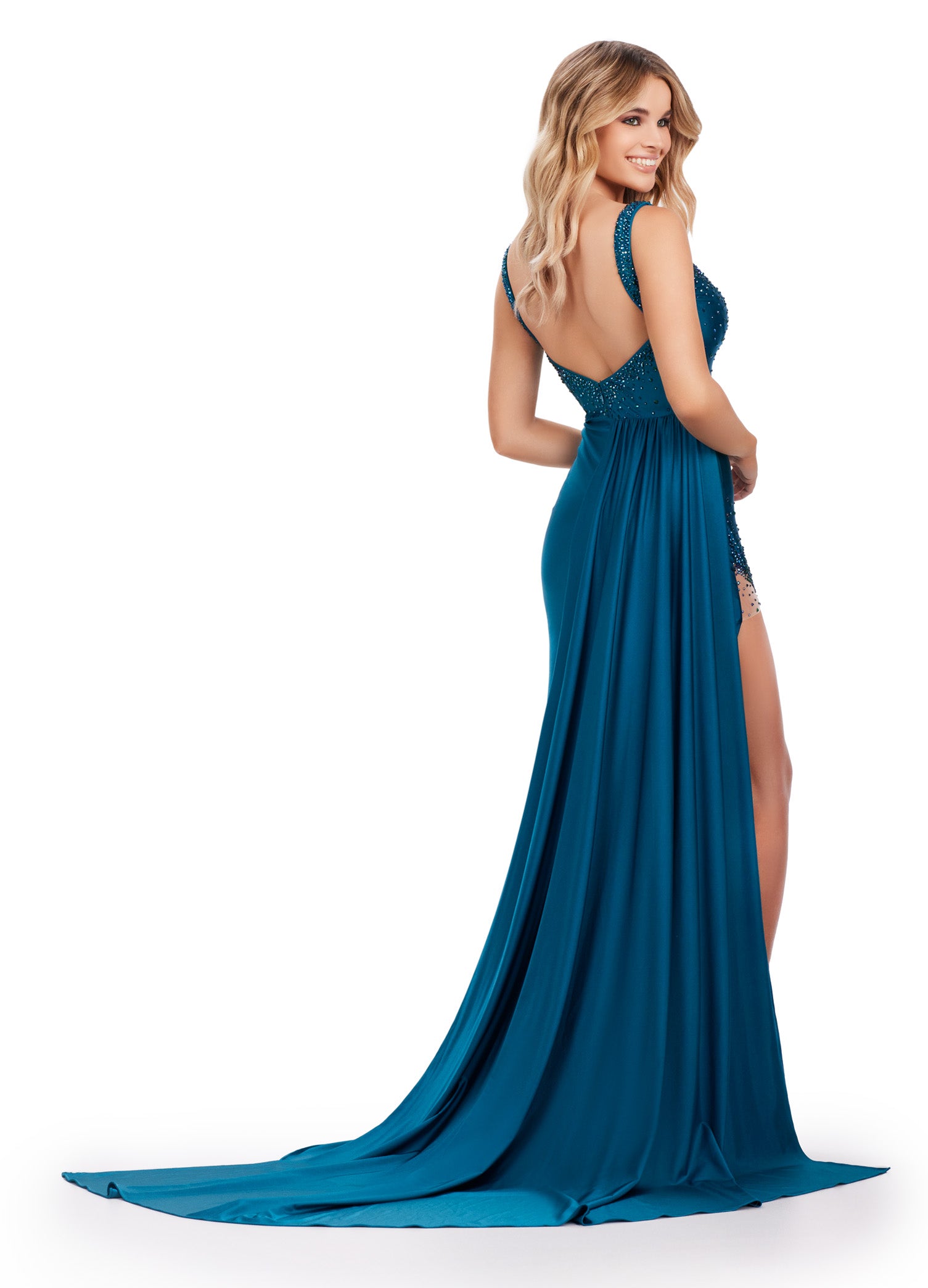 Elevate your formal look with the Ashley Lauren 11579 Long Prom Dress. Made with jersey fabric, this gown features press-on stones and a side skirt slit for added glamour. Perfect for pageants or prom, this dress will make you stand out on any occasion.This unique jersey gown features press on stones and a fabulous side skirt. Perfect for your next event!