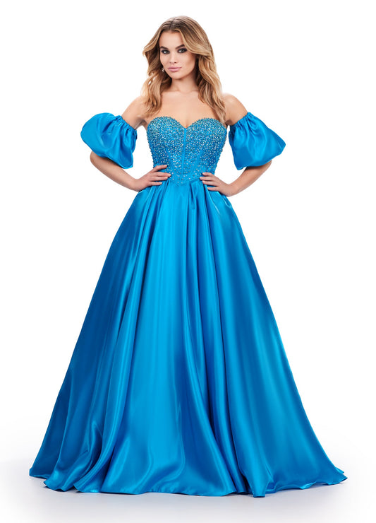 Elevate your formalwear with the Ashley Lauren 11642 prom dress. The luxurious satin fabric, sweetheart neckline, and crystal corset add elegance and charm to this A-line ballgown. The puff sleeves bring a touch of drama and playfulness to your look. Perfect for prom or pageants. A satin ball gown fit for a queen. This strapless dress features a beaded corset bodice with detachable puff sleeves and a lace up back.