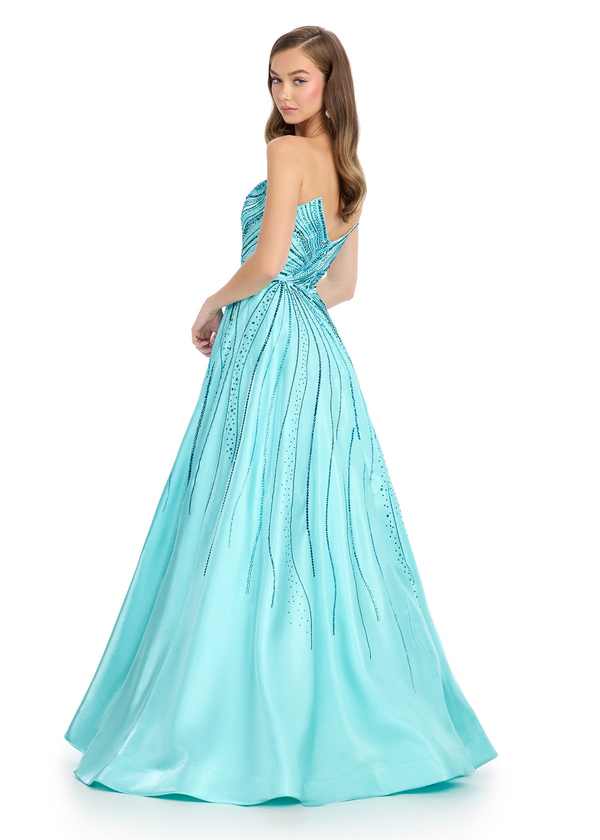 Experience glamour and elegance in the Ashley Lauren 11869 Long Shimmer Satin A Lone Prom Dress. Made with shimmering satin and adorned with sparkling crystals, this strapless gown exudes sophistication. Perfect for proms, pageants, or any special