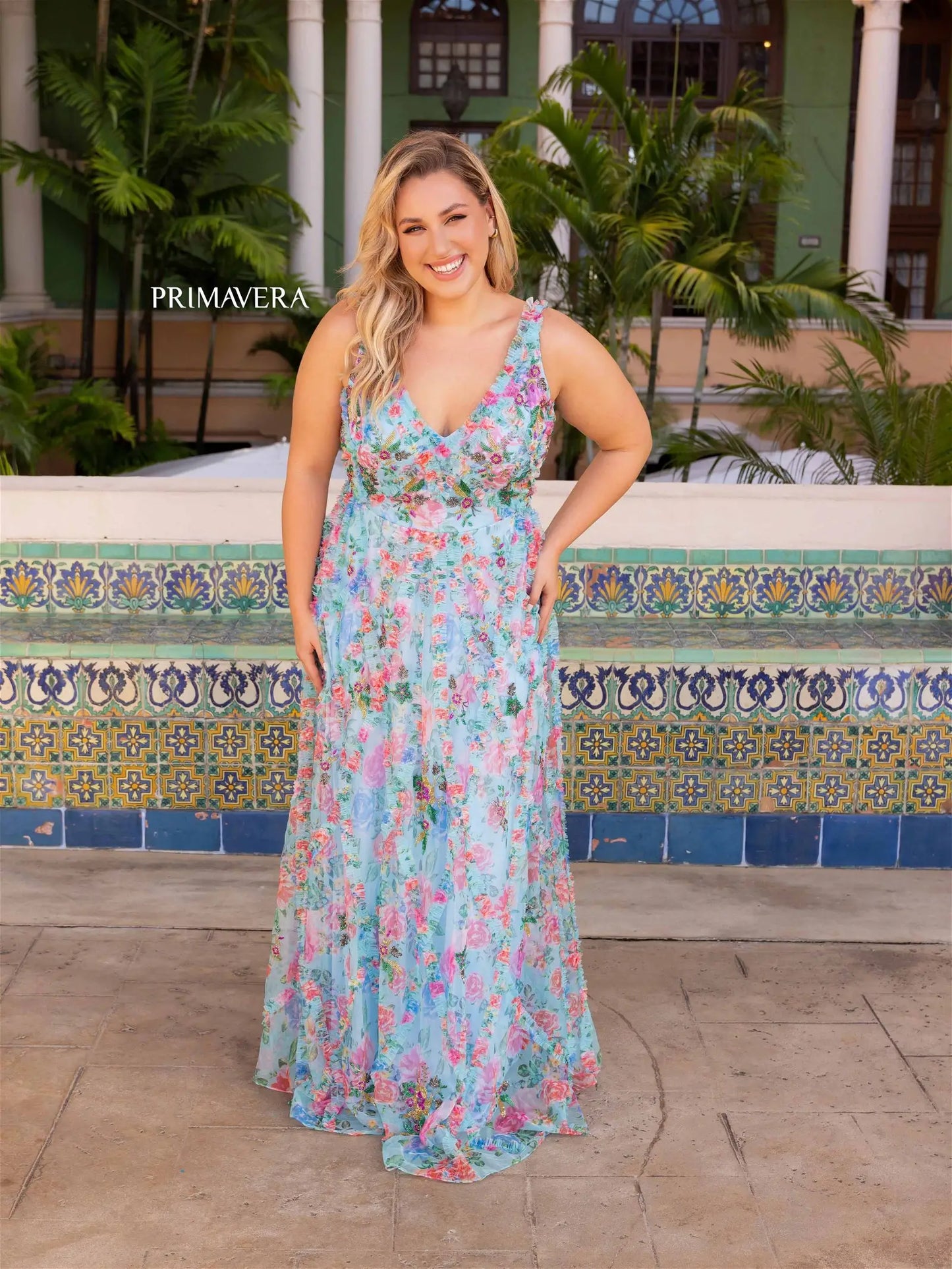 Elevate your style with the Primavera Couture 14046 Long Prom Dress. This stunning plus size gown features a beautiful floral print and elegant beaded detailing along the V-neckline. Perfect for any formal occasion, this dress is sure to make you stand out and feel confident.