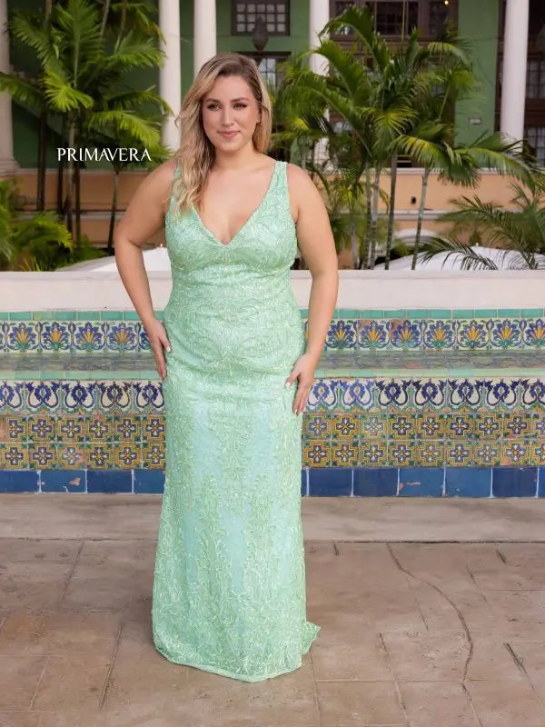 Get ready to dazzle in style with the Primavera Couture 14048 Long Prom Dress. This stunning plus size gown features a fitted sequin design on a V-neckline, perfect for any formal occasion. Make a statement and stand out from the crowd in this glamorous and figure-flattering dress.