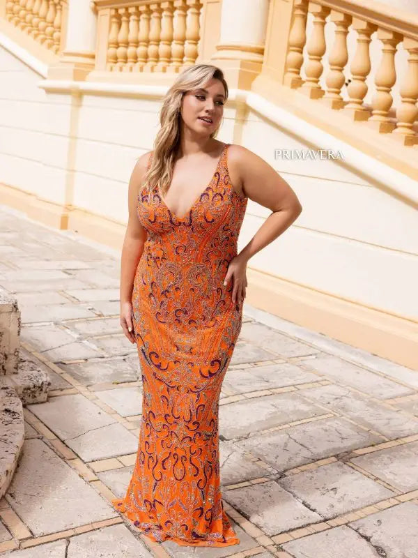 Elevate your evening gown game with the stunning Primavera Couture 14053. This long prom dress features a flattering V-neckline, figure-hugging sequin design, and a fitted silhouette for a glamorous and sophisticated look. Perfect for any formal event, this plus size gown will make you feel confident and beautiful.