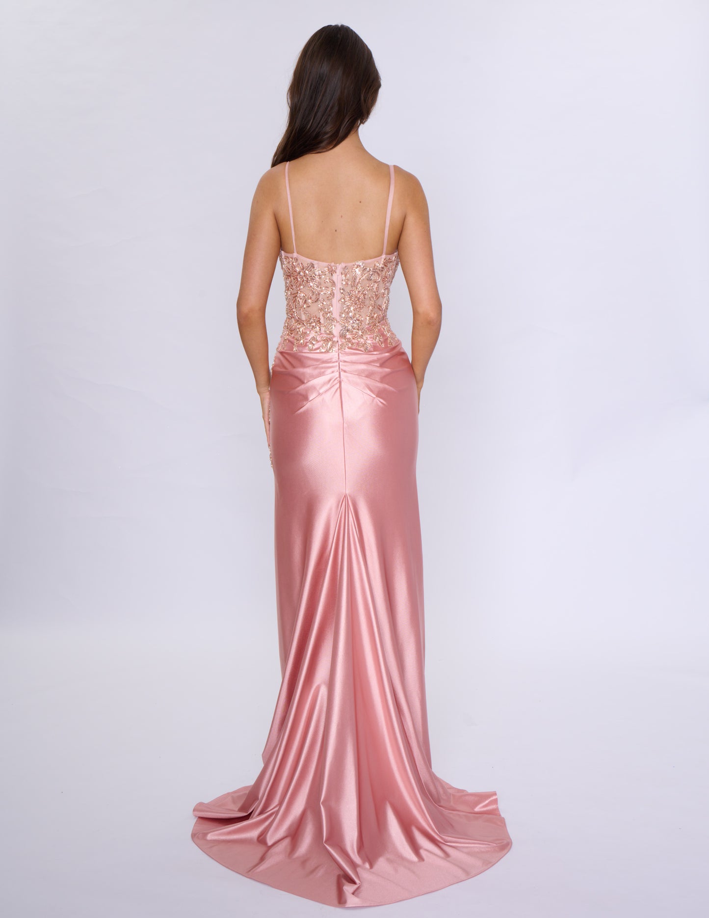 Look stunning at prom or any formal event with the Nina Canacci 1585 Fitted Sequin Long Prom Dress. This figure-hugging gown features a flattering ruched V-neckline and a daring thigh-high slit. The sequin fabric adds a touch of glamour and the long length will make you stand out.

Sizes: 0-14

Colors: Black, Emerald, Rose Gold