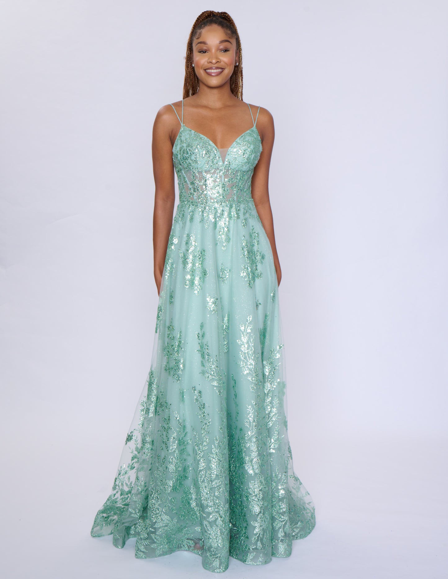 Shine at your prom with the Nina Canacci 1589 Sheer Sequin A Line Prom Dress. Featuring a corset bodice and a V-neckline, this formal evening gown will accentuate your figure. The sheer sequin fabric adds a touch of glamour to your look. Make a statement with this elegant and on-trend dress.

Sizes: 0-18

Colors: Sage, Rose Gold, Mulberry, Navy/Lilac