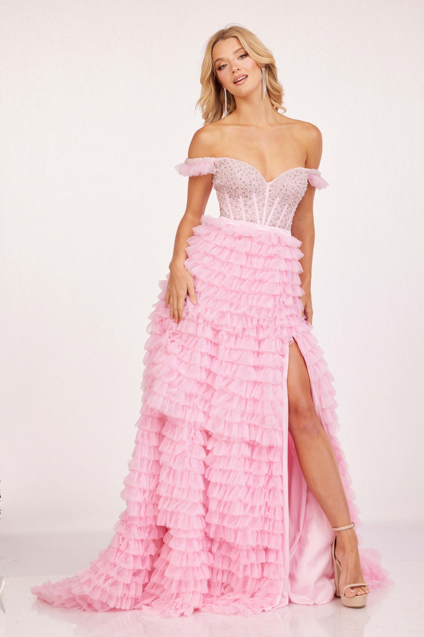 This Cecilia Couture 2224 Ruffle A Line Maxi dress is a stunning option for prom or any formal event. The off the shoulder neckline adds a touch of sophistication, while the ruffle detailing and corset style bodice give it a unique and elegant touch. The A-line silhouette and side slit provide comfort and style, making you the center of attention.