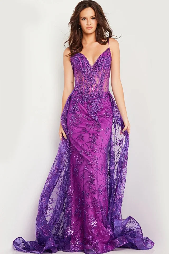 The Jovani 23530 is a show-stopping prom dress from the formal collection, designed to make a dramatic and unforgettable entrance at your special event. Crafted from delicate tulle, this gown exudes an ethereal and graceful quality. In terms of style, the dress follows a sheath silhouette, offering a sleek and contemporary look that gracefully drapes along your figure. 