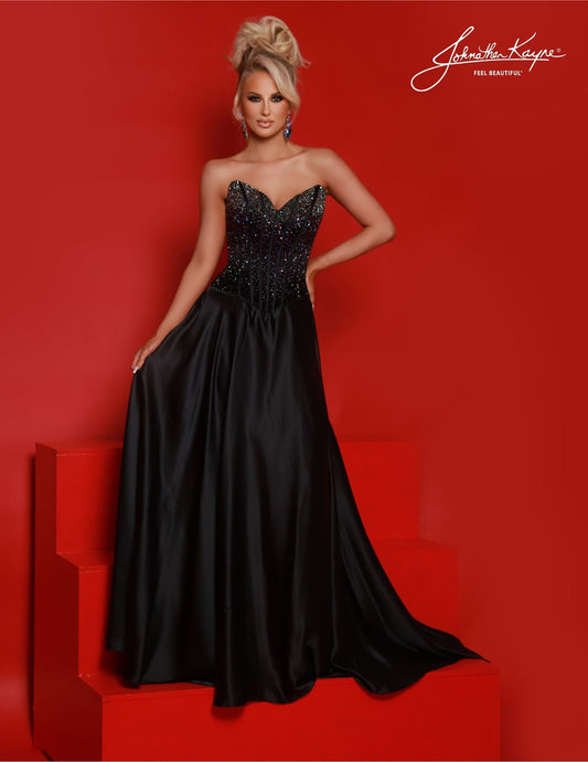 The Johnathan Kayne 2812 is a stunning A-line corset formal gown, crafted with an open back and beading to enhance your silhouette. Perfect for prom or special events, this gown will make you feel like the belle of the ball. Elevate your elegance with this breathtaking strapless ombre beaded bodice – the gradual shift in colors come together to create a show-stopping effect. The flowing A-line skirt makes this perfect for all body types. 