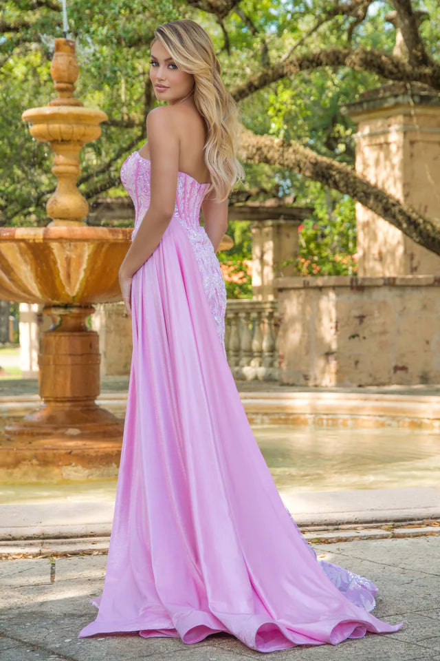 Elevate your formal attire with the Ava Presley 28291 Long Prom Dress. This strapless gown features a flattering corset design, charming side drape, and elegant train. Made with luxurious charmeuse fabric, it exudes sophistication and grace. Perfect for pageants, proms, or any special occasion.