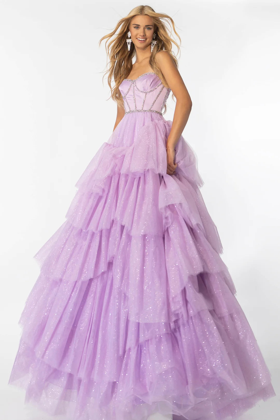 Step out in style with the Ava Presley 28592 Shimmer Tulle A Line Layer Ballgown Prom Dress. This stunning gown features a satin corset and crystal embellishments for a touch of elegance. The A-line silhouette and layered tulle skirt will make you feel like a princess. Perfect for prom or any special occasion.  Sizes: 00-16  Colors: Lilac, Black/White