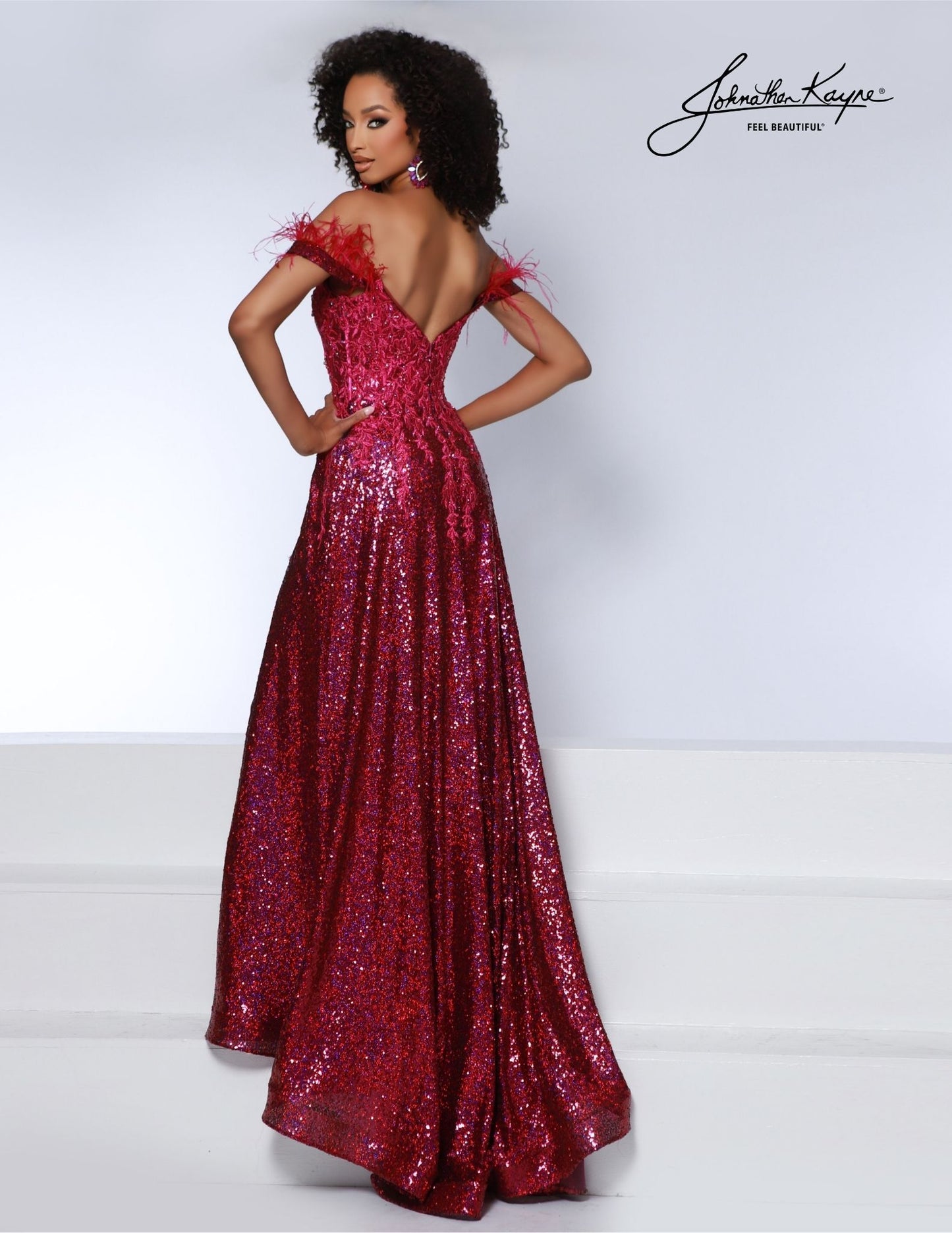 This Johnathan Kayne 2887 gown features a stunning feather and sequin design, with a maxi slit and corset lace detailing for a dramatic and elegant look. Perfect for a prom or formal occasion, this dress is sure to make a statement and turn heads. Ensure you are the talk of the town in this sequin mesh A-line gown featuring a thigh high slit and pockets.