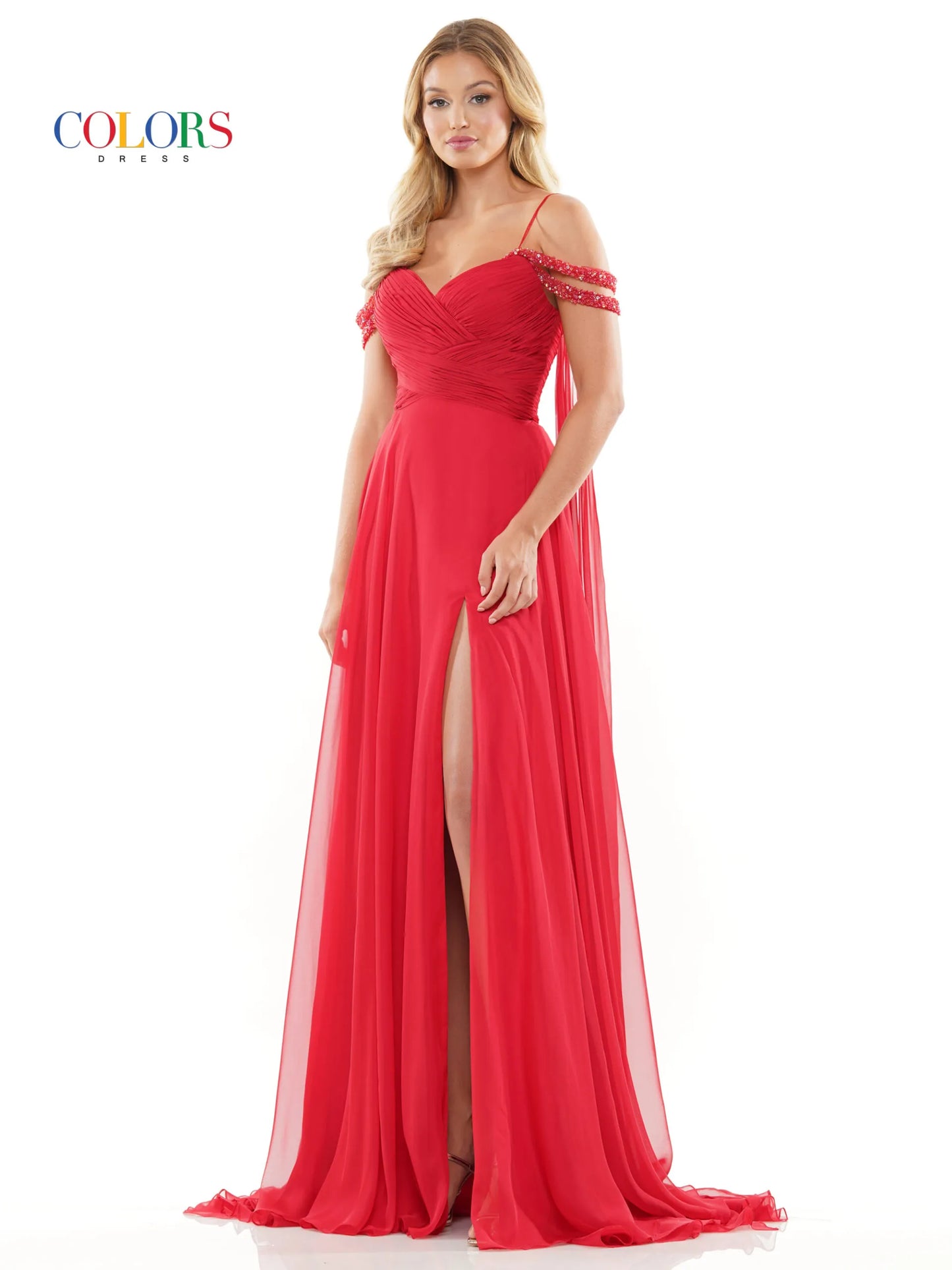 Elevate your style with the Colors Dress 3101 A Line Chiffon Pageant Dress. This stunning gown features an off the shoulder design and double beaded straps for a touch of elegance. The flowing chiffon cape adds a dramatic flair, while the maxi slit showcases your legs. Perfect for prom or any special occasion. corset back   Sizes: 0-20  Colors: Black, Royal, Deep Green, Hot Pink, Wine