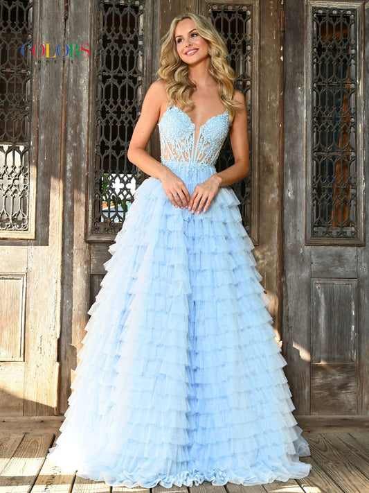 Colors Dress 3219 is a formal gown featuring a long sheer lace embellished v neck corset with ruffled layers and an elegant ball gown skirt. Embellished details add a luxurious touch to the design, making it perfect for proms and special occasions.  Sizes: 2-24  Colors: Black, Light Blue, Mint, Pink