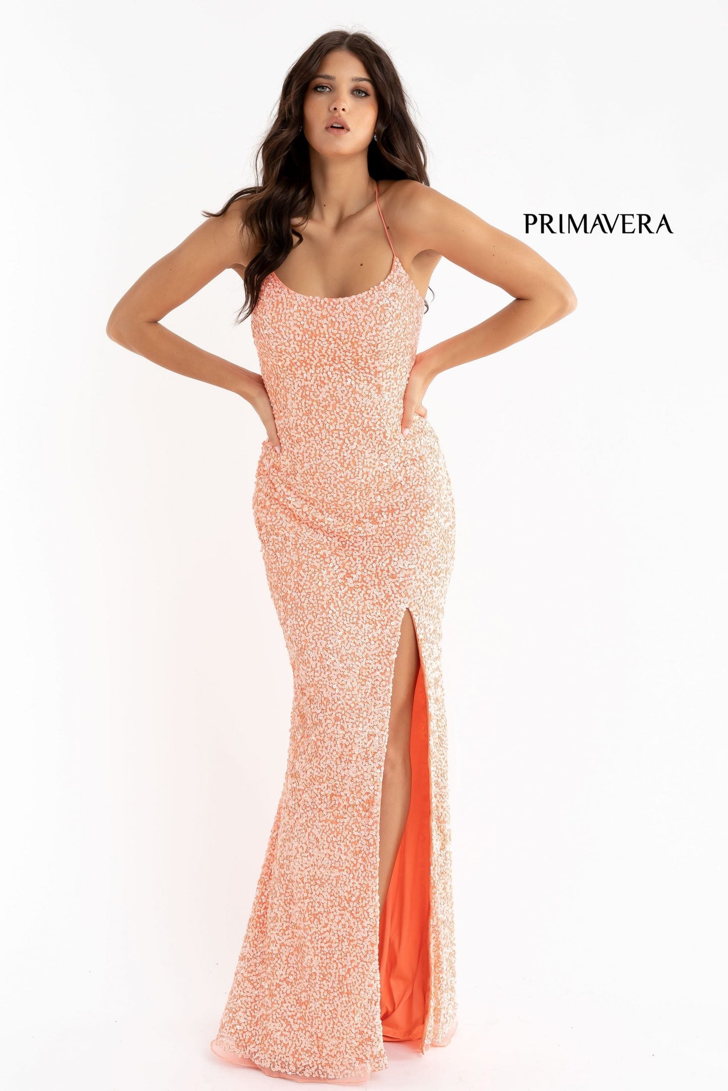 Primavera Couture 3290 This prom dress adds a pop to the multi sequins dress.  With a scoop neckline and spaghetti straps that cross and tie in the back.  This long evening dress has a side slit. And need I say, NEON!  Available Colors: Midnight, Emerald, Turquoise, Plum, Peach, Blue, Black, Fuchsia, Cream, Neon Sage, Neon Coral, Neon Lilac, Bright Blue, Rose, Neon Pink, Orange, Baby Pink, Purple, Royal Blue, Ivory, Gold, Charcoal, Red, Apple Green, Forrest Green, Yellow, Mint  Available sizes:  18, 20, 22