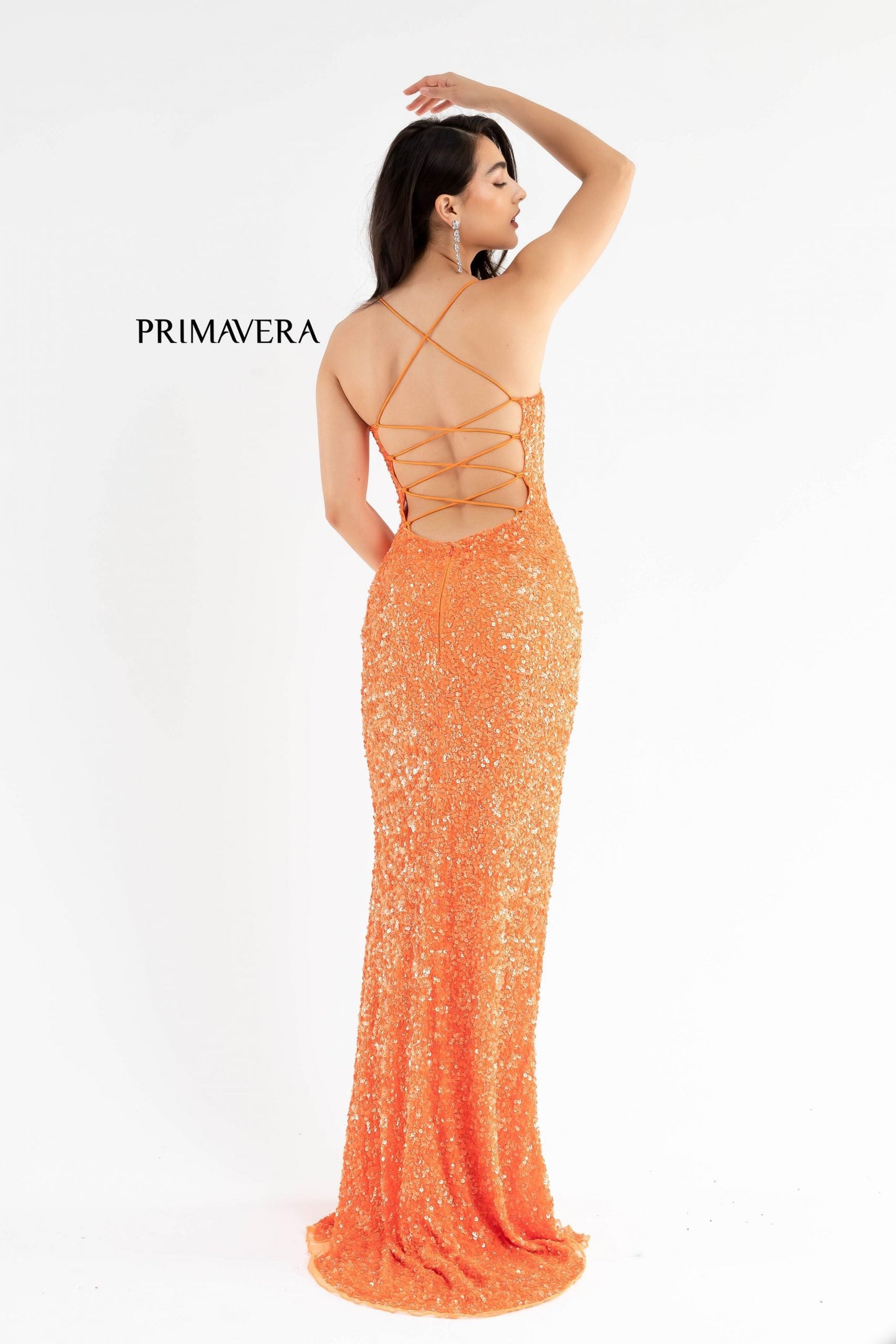 Primavera Couture 3290 This prom dress adds a pop to the multi sequins dress.  With a scoop neckline and spaghetti straps that cross and tie in the back.  This long evening dress has a side slit.  Available sizes:  000, 00, 0, 2, 4, 6, 8, 10, 12, 14, 16