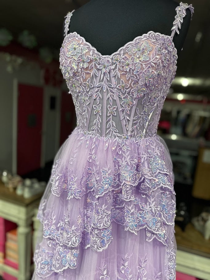 The Jovani 36687 is a breathtaking prom dress that belongs to the formal collection, designed to make a lasting impression at any special occasion. This enchanting gown is made from delicate tulle, a fabric known for its ethereal and lightweight quality.