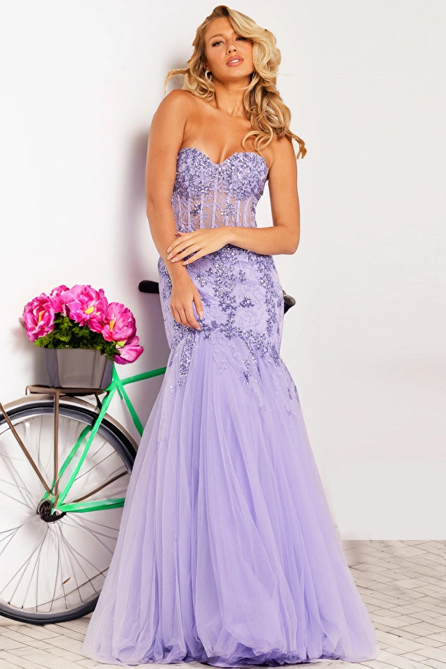 The Jovani 37249 is a dazzling formal gown that exudes glamour and sophistication. Part of the formal collection, this mermaid-style dress is crafted from delicate tulle material, adding an ethereal and romantic quality to the overall design.  The gown is adorned with sequin embellishments and intricate embroidery, creating a stunning play of light and texture. The flare bottom adds a touch of drama, ensuring a captivating and memorable entrance. 