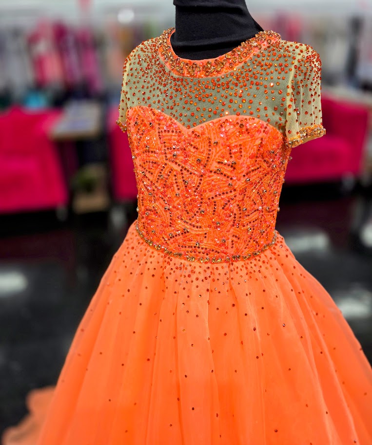 This Ava Presley 38043 Girls Pageant Dress features a Sheer High Neck design, Ballgown silhouette, cap sleeves, and a crystal organza Train. Perfect for pageants and special occasions. The elegant design will make your little girl feel like a princess, while the high-quality materials ensure comfort and durability. The Ava Presley 38043