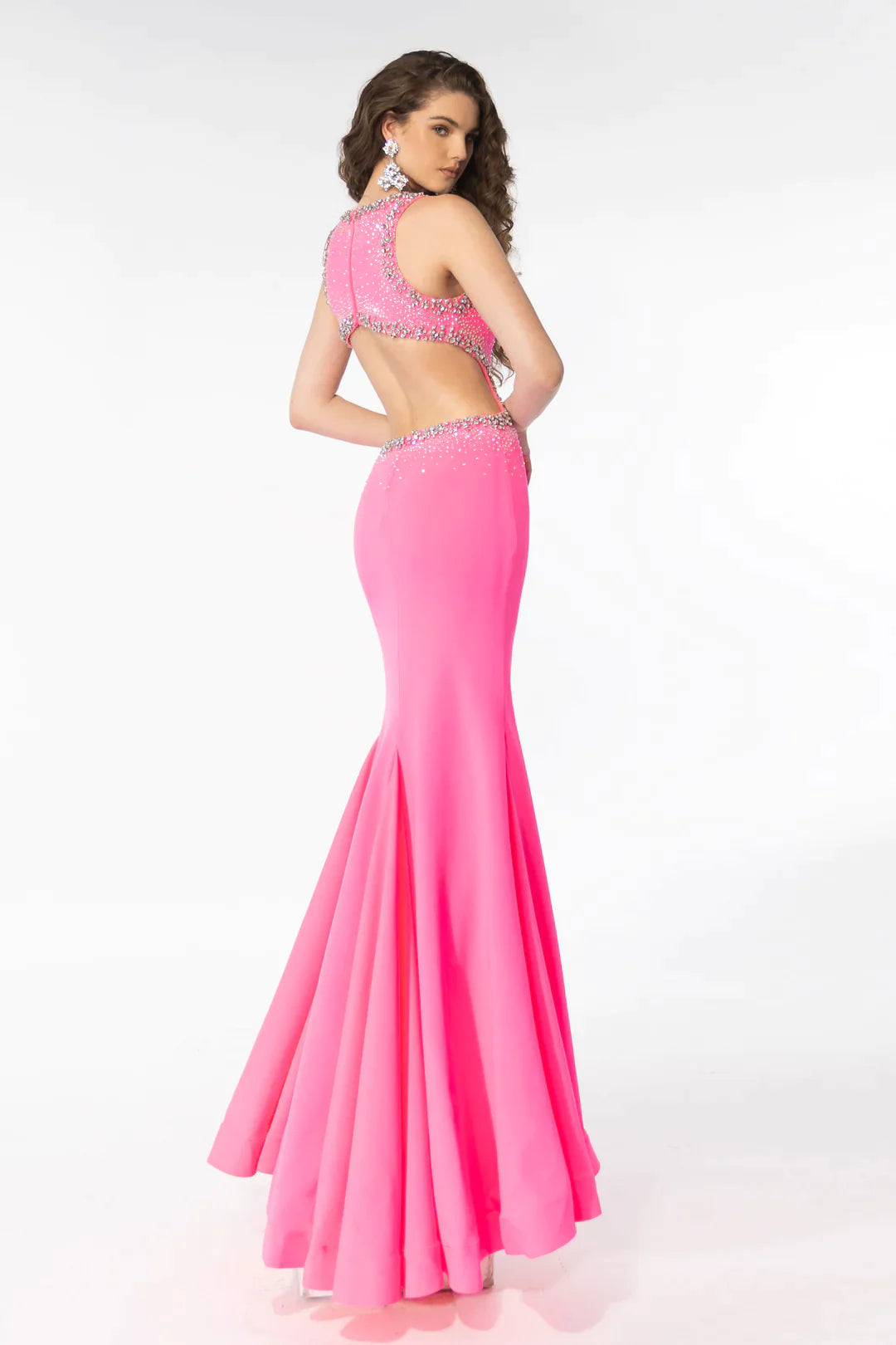 Elevate your prom look with the Ava Presley 39237 Long Prom Dress. The open back, cut out design, and high slit adds a touch of drama while the beaded detailing gives it a glamorous touch. Perfect for formal events and pageants.