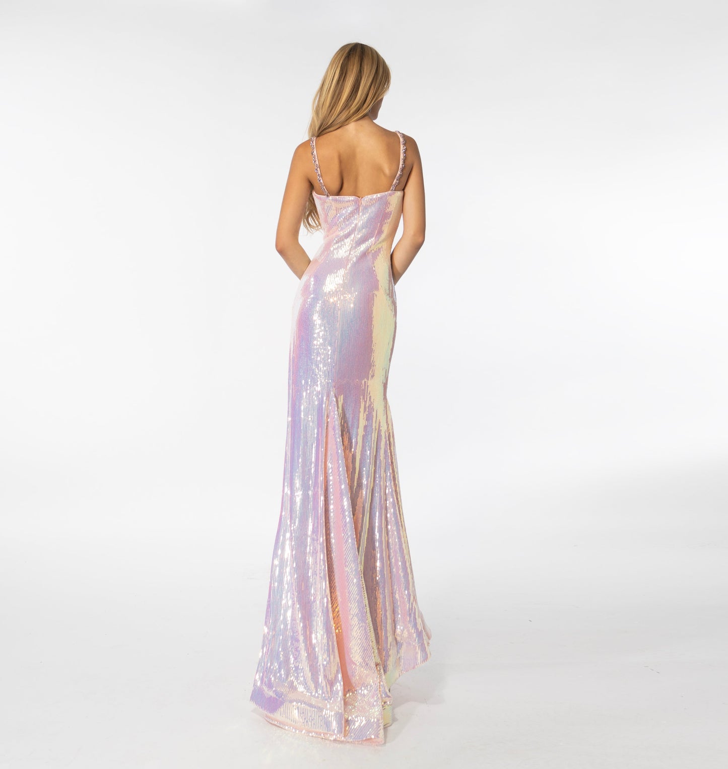 Make a grand entrance in this stunning Ava Presley 39261 gown. Crafted from lightweight sequins, this fitted long dress features a deep V-neckline, a low back, a thigh-high slit, and a gracefully sweeping train. Elegant crystals accent the neckline, highlighting an already beautiful silhouette. A timeless choice for your special occasion.  Size: 00-14   Colors: Iridescent Pink, Black