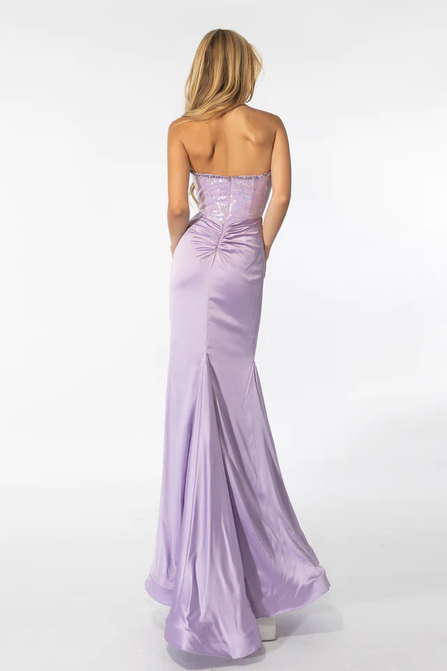 Crafted from high-quality materials, the Ava Presley 39282 Strapless Long Prom Gown is the perfect choice for any formal event. The sequin bodice adds a touch of sparkle, while the charmeuse skirt provides a soft and elegant look. Stand out in style with this stunning and versatile dress.