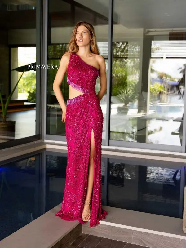 Looking for a show-stopping prom dress? Look no further than the Primavera Couture 4101. This stunning gown features intricate sequin and bead detailing, a flattering corset bodice, and a one shoulder design. The fitted cut out silhouette is perfect for any formal event or pageant. Level up your style and confidence in this eye-catching dress.