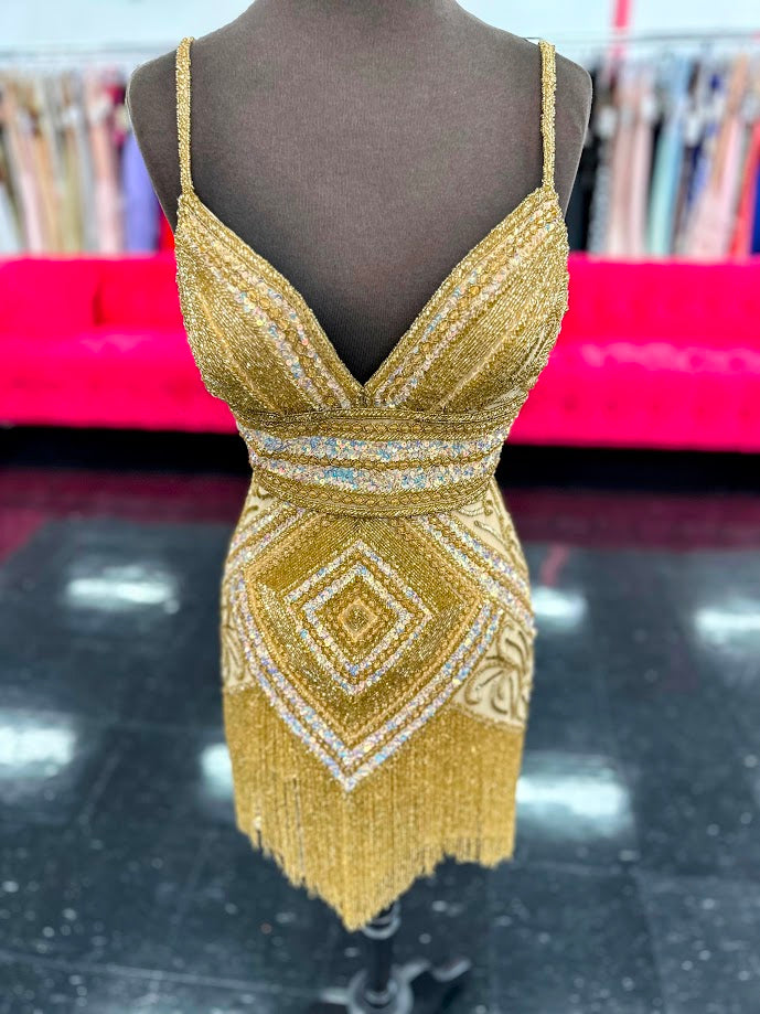 Be the center of attention in the Jovani 41101 Short Beaded Fringe Cocktail Dress. The stunning sequin skirt, v-neckline, and corset top make for a glamorous and figure-flattering look. Perfect for homecoming or any formal event, this dress offers 100% style with no compromise on comfort.