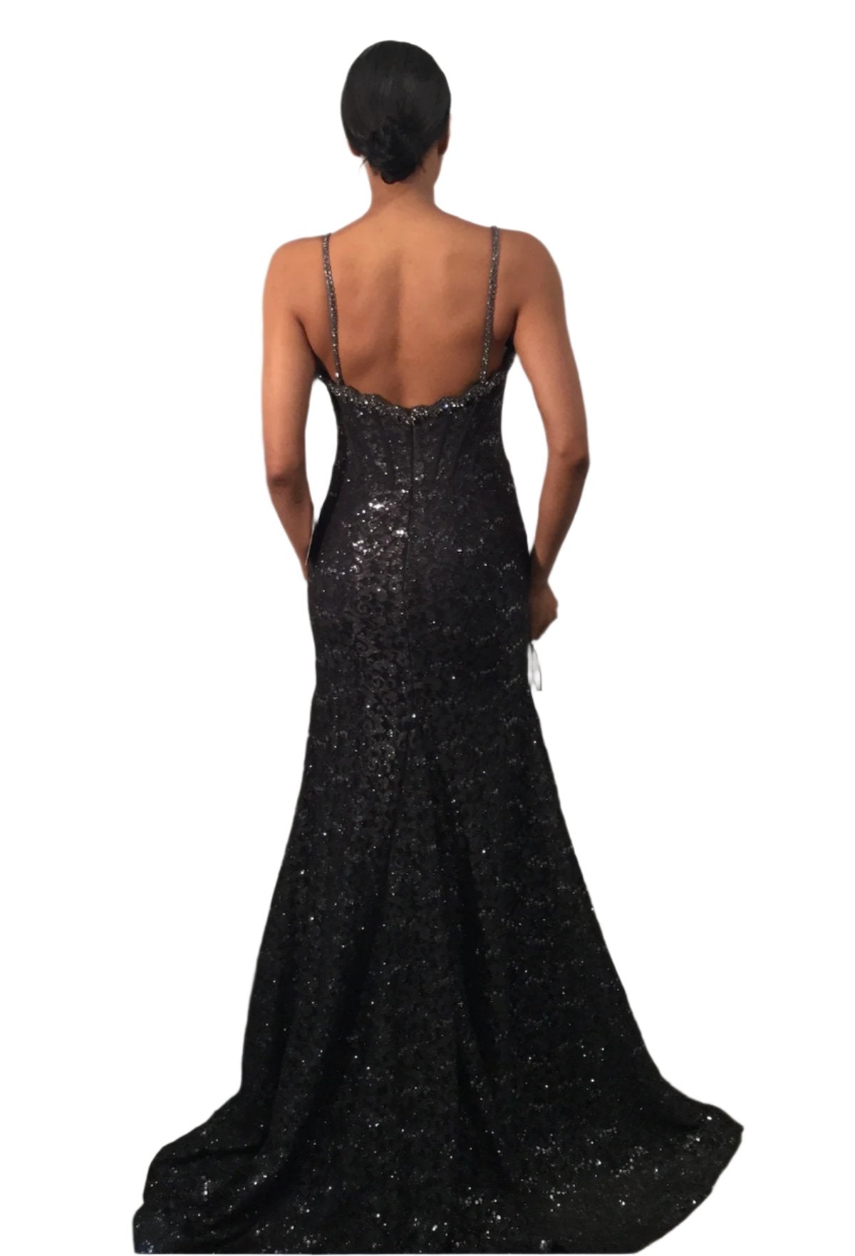 Be the belle of the ball in the Jovani 43061 Long Lace Prom Dress. This shimmering gown features a flattering cut-out design and a crystal corset for a touch of glamour. The lace detailing adds a romantic touch, making it perfect for prom, pageants, or any formal occasion. You'll shine as you glide across the room in this stunning dress. This stunning full-length gown is adorned with dazzling sequins, creating an eye-catching sparkle.