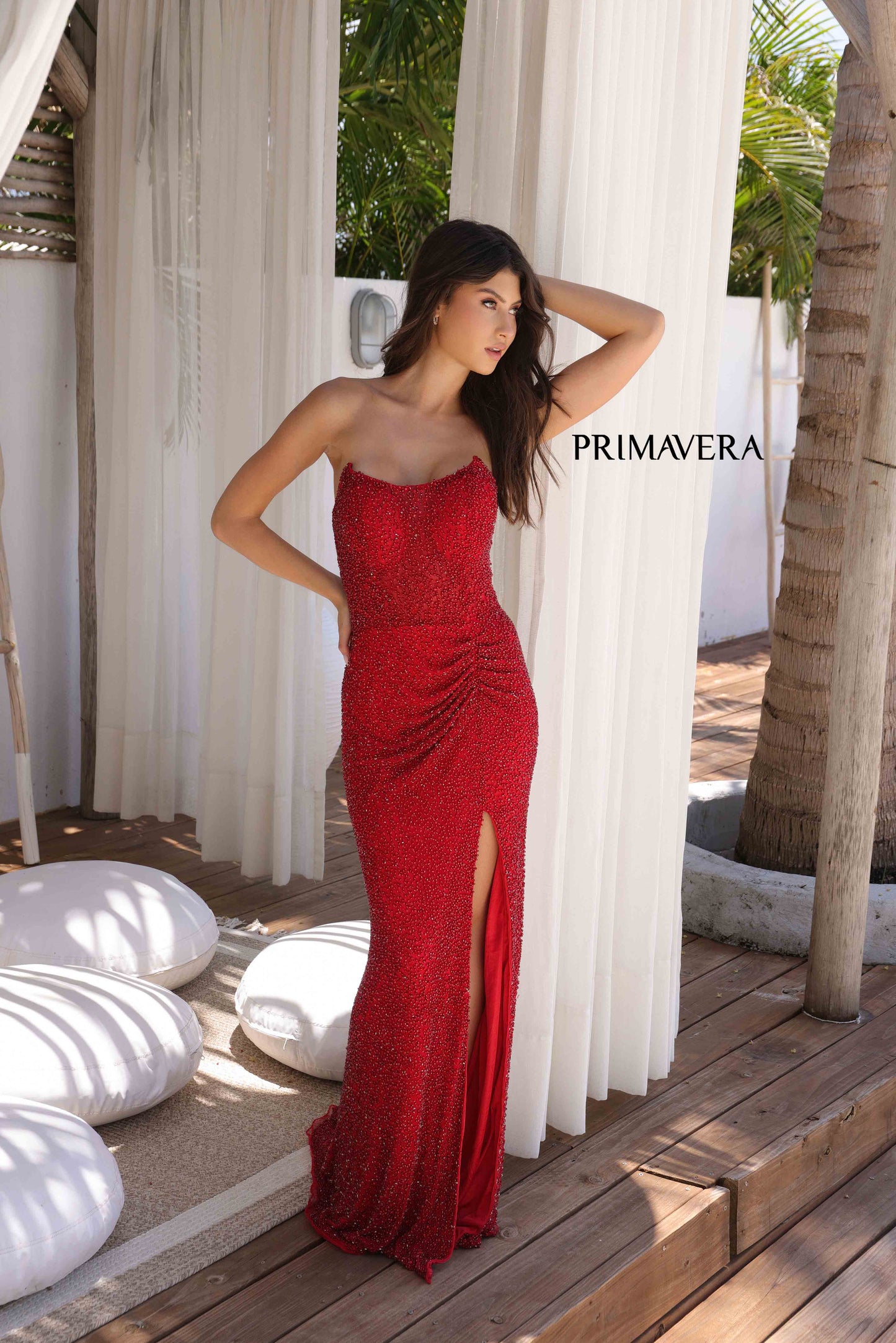 Elevate your look with the Primavera Couture 4364 Sheer Crystal Corset Prom Dress. This stunning gown features a sequin-beaded bodice with a scoop neck and sheer corset cutouts. The flowing skirt is complete with a high slit for a touch of elegance. Perfect for formal occasions, this dress is sure to make you feel confident and glamorous.

Sizes: 000-16

Colors: Red, Nude, Black, Purple, Teal