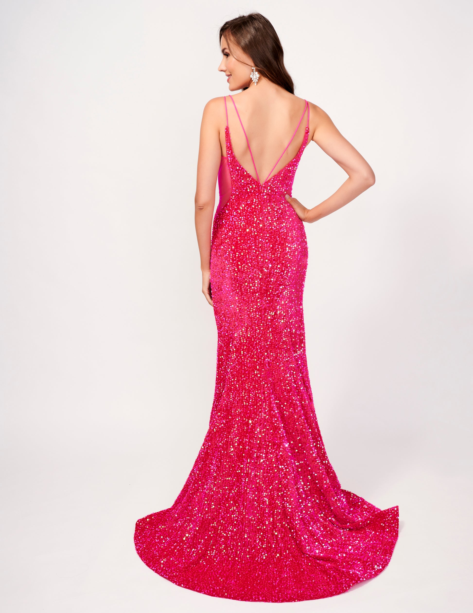 Elevate your style with the Nina Canacci 4420 Velvet Sequin Mermaid Prom Dress. Featuring a striking sheer v-neckline and stunning velvet sequin design, this formal evening gown is sure to make a statement. With its flattering mermaid silhouette, it's the perfect choice for a prom or special occasion.